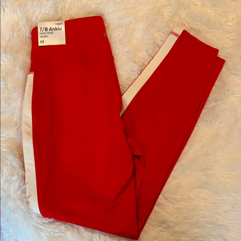Red leggings with two white stripes